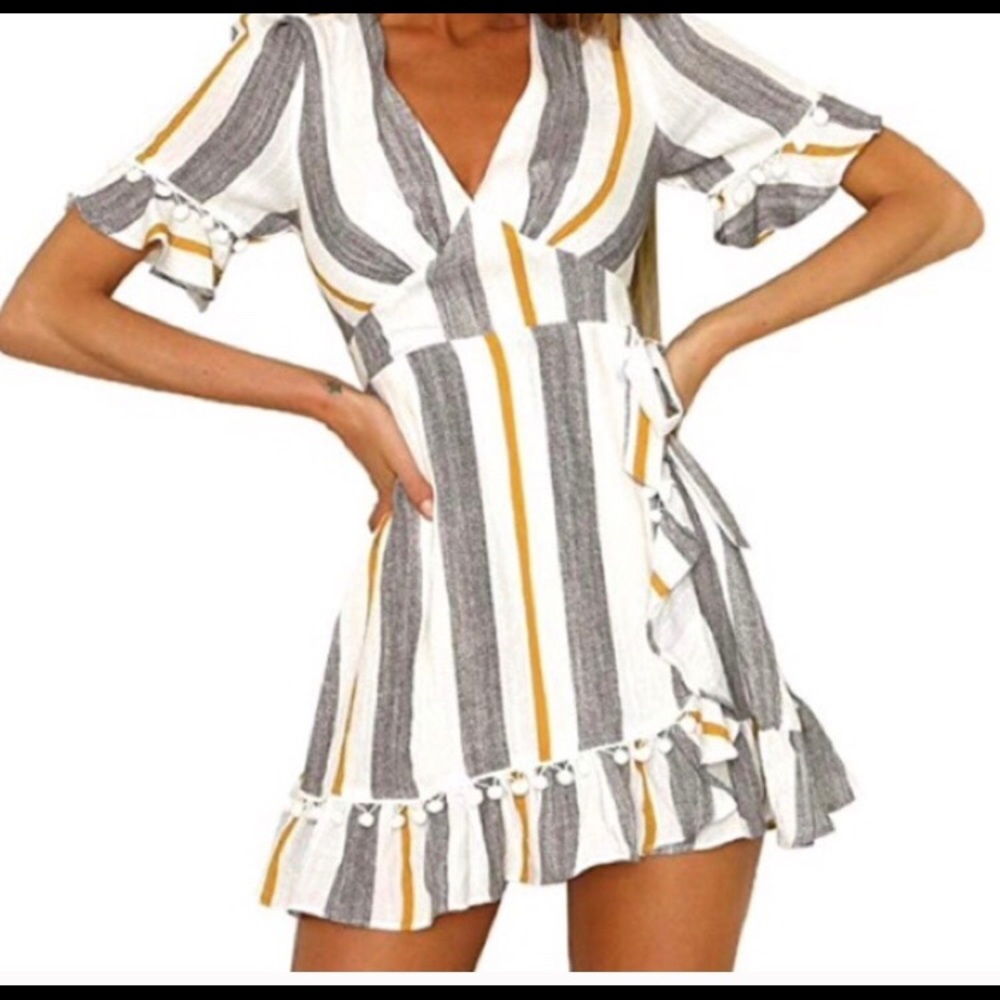 Striped dress with Pom poms